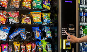 Contactless vending machine with Nayax tap-to-pay credit card reader in an Australian workplace